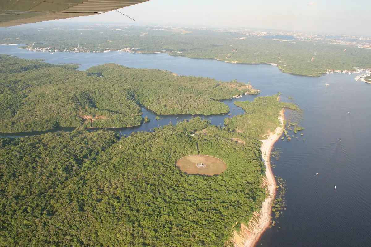 The dark Rio Negro with forested islands from the air